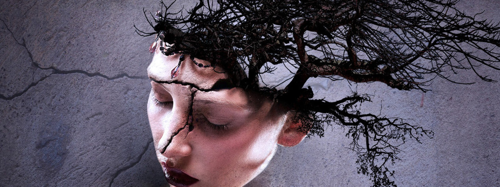 An artistic depiction of a tree growing out of a woman's head.