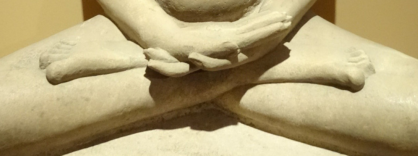 The legs of a seated statue of the Buddha, siting in the diamond position, or Vajrasana.