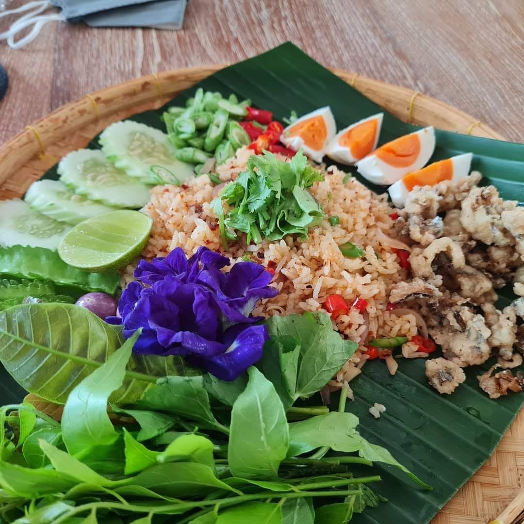 Thai herbal dish with rice and fish served at Coco Paradiso Pool Cafe